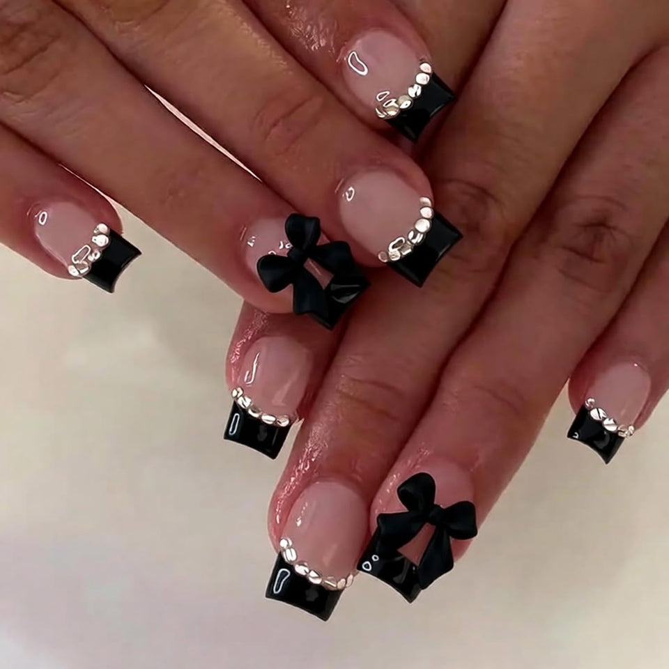 Generic front packaging of press on nails showing black French tips and bows, showcasing easy application benefit
