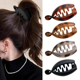 Generic front packaging showing four leopard banana clips and colorful appeal