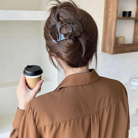 Generic clips on bathroom counter in lifestyle scene suggesting convenient daily use