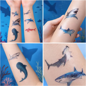 Generic children wearing shark tattoos at party, fun group activity