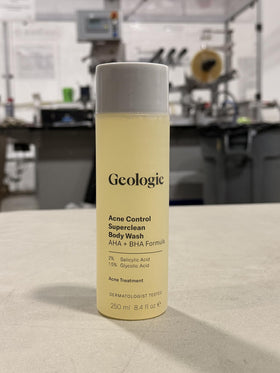 Geologie bottle in hand showing 8.4 fl oz scale and travel-friendly size