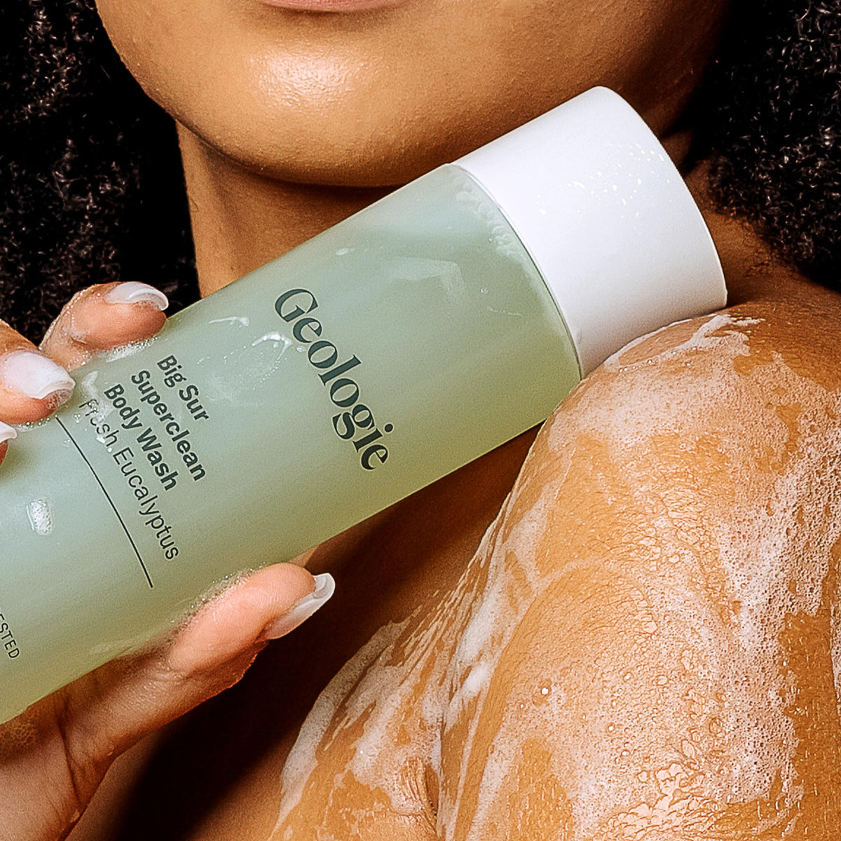 Geologie bottle in a shower setting suggesting invigorating eucalyptus refresh