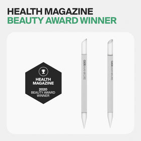 Hand holding GERMANIKURE tool pushing a cuticle for precise, salon-quality results