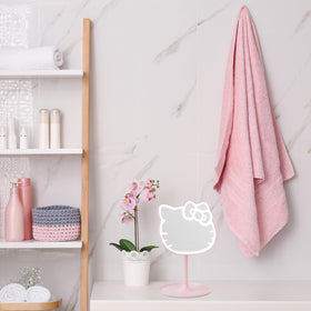 Get Trend Hello Kitty beside hand for scale showing lightweight travel benefit