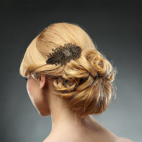 Geyoga barrettes held in hand to show size and lightweight convenience