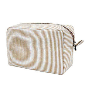 GFU front view of brown seersucker cosmetic bag showing compact design benefit