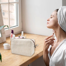 GFU pouch staged with suitcase and essentials showing travel convenience benefit