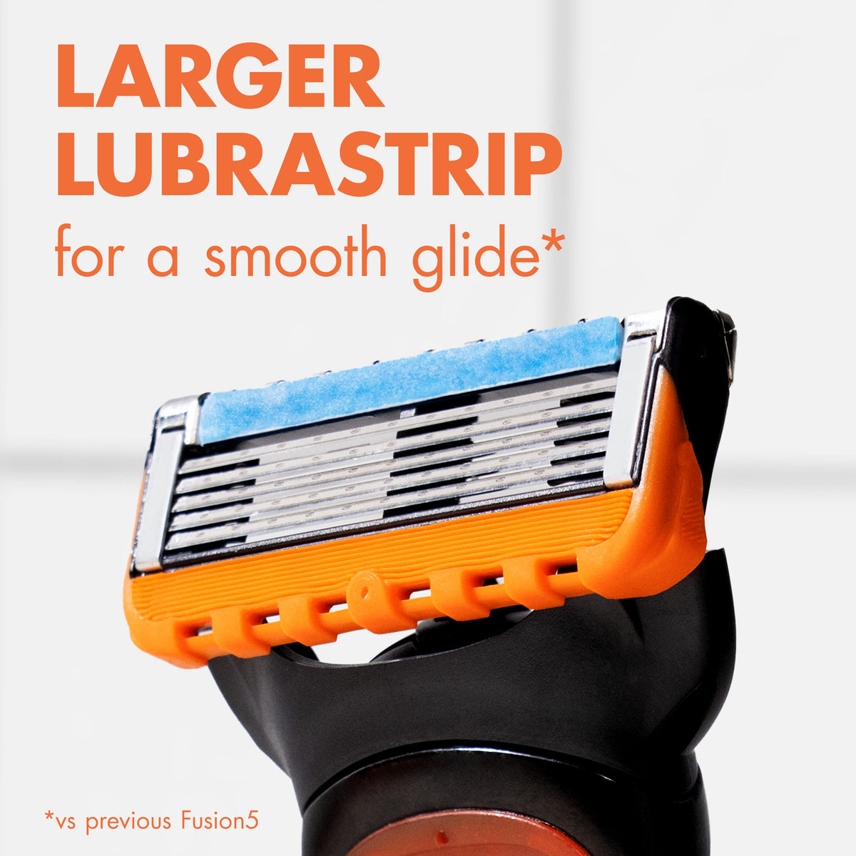 Gillette Fusion5 cartridge in use on a face demonstrating smooth wet shave