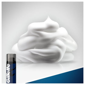Hand applying Gillette Sensitive Skin shaving foam to face for comfortable glide