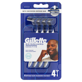 Four Gillette SkinGuard razors laid out to show pack contents and travel readiness