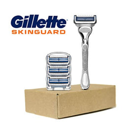 Gillette SkinGuard set arranged on bathroom counter suggesting a soothing shaving routine