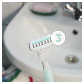 Gillette Venus cartridge next to a ruler demonstrating compact size and control