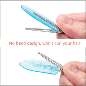 Gingbiss clips in hand showing compact 6cm length for easy handling