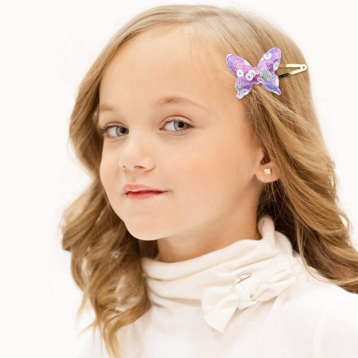 Gingbiss clips styled with a party dress illustrating festive accessorizing