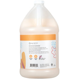 Ginger Lily Farms pouring refill into dispenser for easy, economical refill