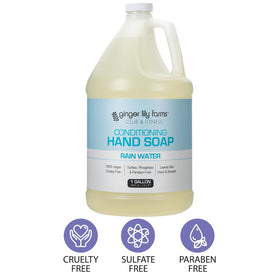 Ginger Lily Farms pouring refill into wall dispenser in gym bathroom