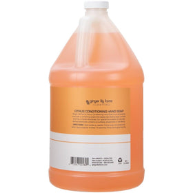 Ginger Lily Farms pouring liquid into dispenser for easy refill convenience