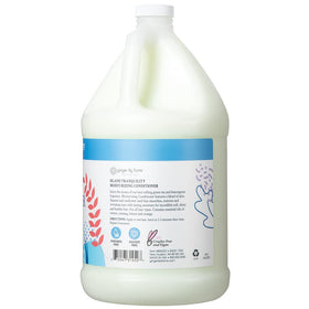 Ginger Lily Farms being poured into a pump bottle for easy refill and savings