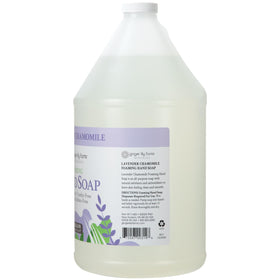 Ginger Lily Farms pouring refill into dispenser to reduce plastic waste