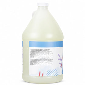 Ginger Lily Farms pouring refill into dispenser to reduce plastic waste