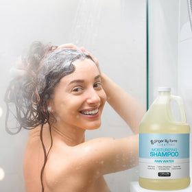 Ginger Lily Farms bottle in spa bathroom conveying vegan care and calming scent