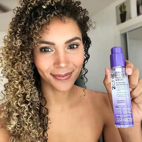 GIOVANNI applying serum to damp hair to show frizz control and smoother styling