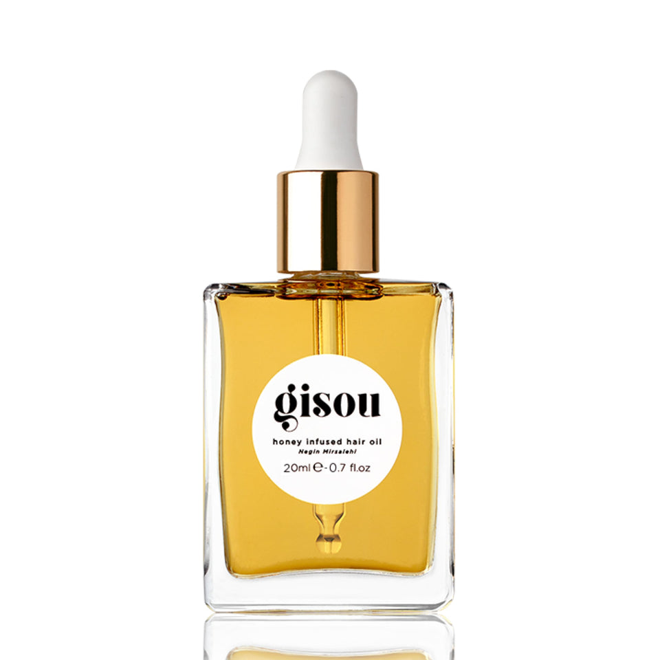 Gisou mini bottle front view showcasing compact travel-friendly design