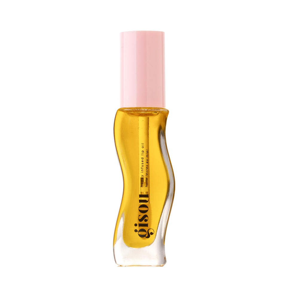Gisou front tube showing Fresh Honey shade and sleek packaging for easy travel