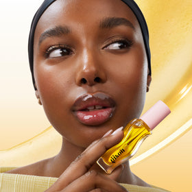 Gisou lip oil texture swirl highlighting glossy, non-sticky finish benefit