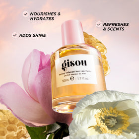 Gisou close-up mist on hair displaying glossy finish and lightweight feel