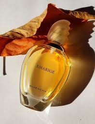 Givenchy Amarige mist in use on wrist demonstrating fresh daytime wear benefit