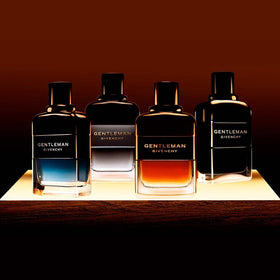 Givenchy bottle beside wood grain illustrating the fragrance's woody character