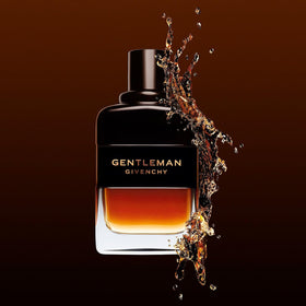 Givenchy Gentleman styled with wood props illustrating whisky-inspired warm character