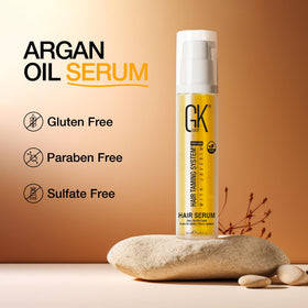 GK HAIR travel-size bottle in purse highlights portability for on-the-go styling