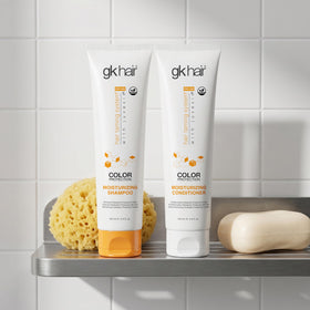 GK HAIR applied to curly hair while detangling for improved manageability