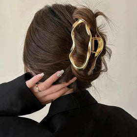 GLINLS holding thick hair in an elegant updo for all-day security