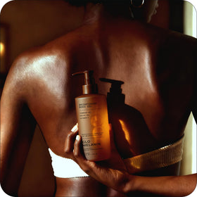 Glo Melanin application on arm demonstrating smooth absorption and hydration