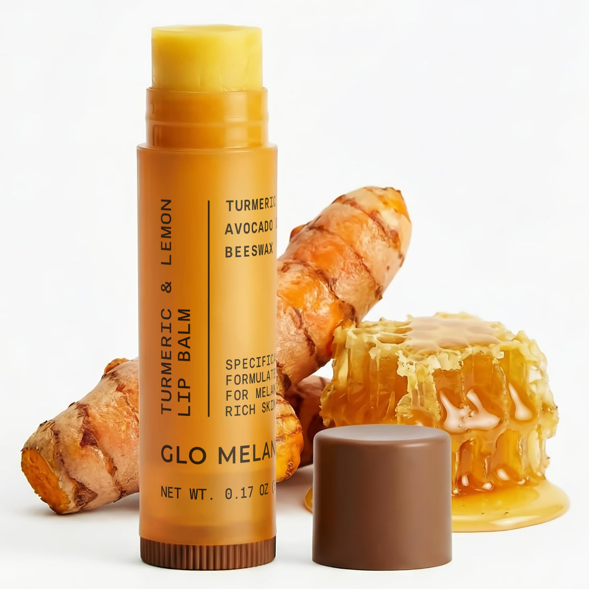 Glo Melanin front packaging showing lemon and turmeric, highlights natural brightening