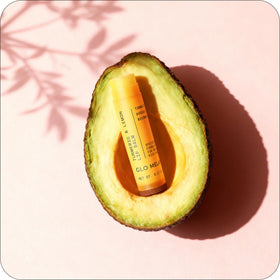 Glo Melanin ingredients flatlay with turmeric and lemon, showcases botanical formulation