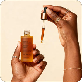 Glo Melanin serum absorbed into skin showing hydrated radiant finish