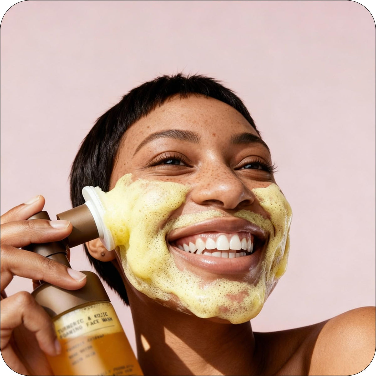 Glo Melanin bottle held in hand showing 120 ml scale and portability