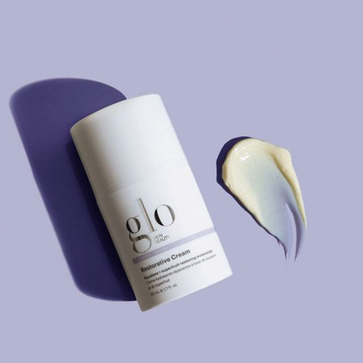 Glo Skin Beauty hand applying cream to cheek, shows immediate smoothing benefit