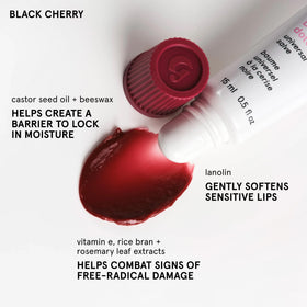 Glossier Balm Dotcom applied to cuticle area, softens and conditions skin