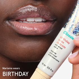 Glossier Balm Dotcom used on cuticles to soften and hydrate dry nail skin