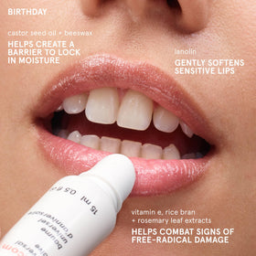 Glossier Balm Dotcom ingredients shot highlighting lanolin and beeswax nourishing benefits