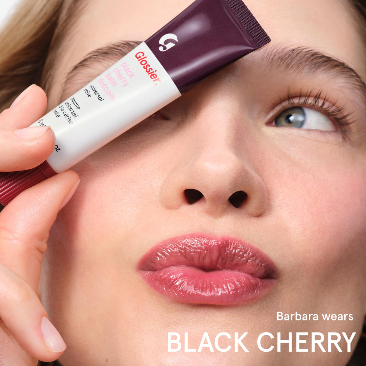 Glossier Balm Dotcom ingredients display with lanolin and beeswax, nourishing blend