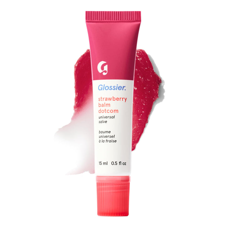 Glossier Balm Dotcom tube front view showing strawberry tint and compact design, nourishing care