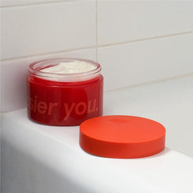 Glossier product side profile showing sleek packaging for shelf appeal