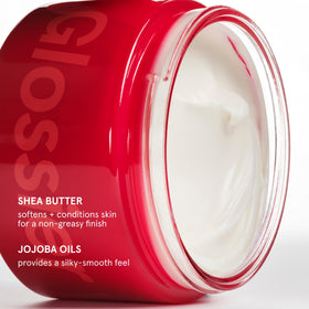Glossier jar beside everyday objects showing 215ml scale benefit