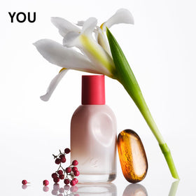 Glossier Doux mini angled to show label and bottle finish benefit clear scent identification